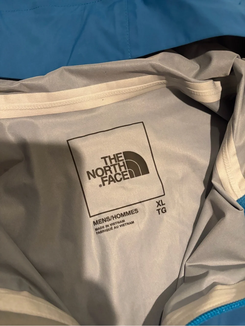 The North Face Blue and Gray Hooded Rain Jacket